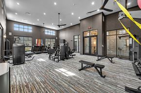 Marysville apartment for rent - A gym with a variety of equipment including treadmills, weights, and a bench press.