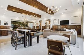 Grove City apartment for rent - A modern dining room with a wooden table and chairs.