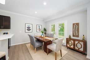 Powell townhouse for rent - a dining room with a wooden table and chairs