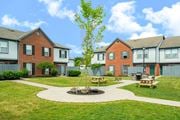 Dublin apartment for rent - a fire pit in the middle of a yard in front of houses