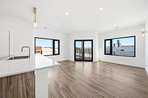 Dayton apartment for rent - A spacious room with a white counter and wooden flooring.