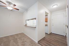 Circleville apartment for rent - a bedroom with a ceiling fan and a door to a bathroom