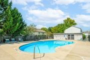 Worthington townhouse for rent - our apartments have a resort style pool with chairs and a fence