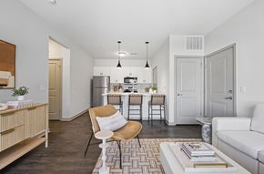 Grove City apartment for rent - A modern kitchen with a dining table and chairs.