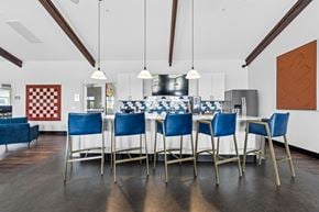 Columbus apartment for rent - A dining room with a checkered red and white wallpaper on the wall.