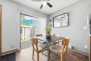 Columbus townhouse for rent - A dining room with a table and chairs and a ceiling fan.