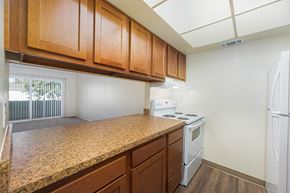 Circleville apartment for rent - a kitchen with a granite counter top and white appliances