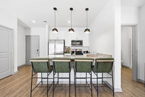 Marysville apartment for rent - A kitchen with a table and chairs in the middle.