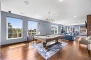 Columbus townhouse for rent - A room with a pool table and a view of the outside.