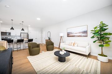 Sunbury apartment for rent - A living room with a white couch and a painting on the wall.