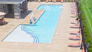 Columbus apartment for rent - an aerial view of a swimming pool with chairs around it