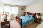Galloway apartment for rent - a bedroom with a bed and a dresser and a window