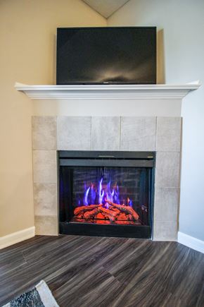 Canal Winchester apartment for rent - a fireplace with a tv above it