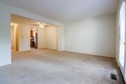 Grove City townhouse for rent - an empty living room with white walls and carpeting