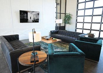 Modern clubhouse featuring garage doors for a dual indoor / outdoor atmosphere