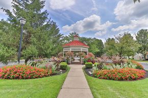 Reynoldsburg townhouse for rent - a gazebo in the middle of a park with flowers