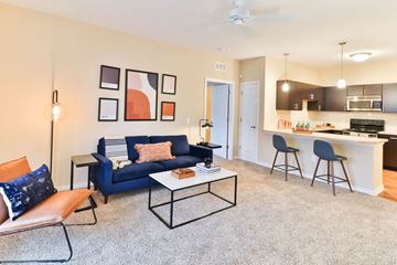 Columbus apartment for rent - a living room with a blue couch and a coffee table