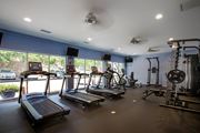 Atlanta apartment for rent - A gym with treadmills, elliptical machines, and other exercise equipment.