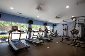 Atlanta apartment for rent - A gym with treadmills, elliptical machines, and other exercise equipment.