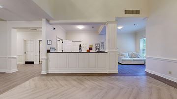 Atlanta apartment for rent - A spacious living room with a white sofa and a wooden floor.