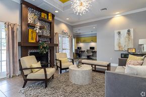 Savannah apartment for rent - A living room with a fireplace and a chair.