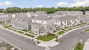 Baton Rouge apartment for rent - A large, modern residential complex with multiple buildings and a spacious parking lot.