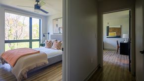 Atlanta apartment for rent - A bedroom with a bed and a ceiling fan.