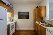 Atlanta apartment for rent - Kitchen witih wooden floors overhead storage and pantry space at Gateway Place in Atlanta, Georgia