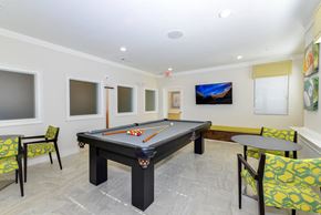 Roswell apartment for rent - A room with a pool table and chairs.