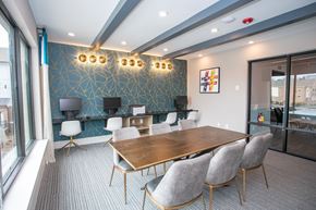 Atlanta apartment for rent - A conference room with a long table and chairs.
