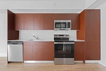 Opa Locka apartment for rent - A modern kitchen with a stainless steel dishwasher and oven.