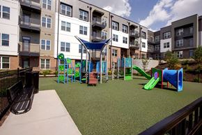 Atlanta apartment for rent - A playground with a slide, swings, and a climbing frame.