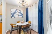 Atlanta apartment for rent - A dining room with a white table and chairs.
