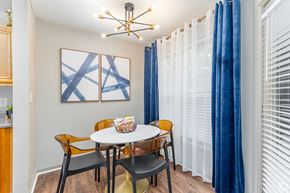 Atlanta apartment for rent - A dining room with a white table and chairs.