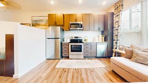 Atlanta apartment for rent - A modern kitchen with wooden cabinets and stainless steel appliances.