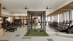 Brooklyn apartment for rent - A gym with a variety of equipment including treadmills, weights, and benches.