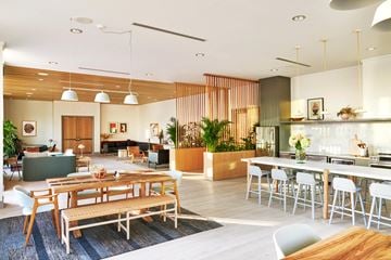 New Orleans apartment for rent - a living room and dining room with tables and chairs and a kitchen