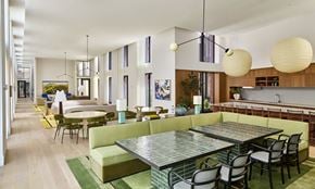 Long Island City apartment for rent - A modern dining room with a glass table and chairs.