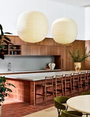 Long Island City apartment for rent - A kitchen with a long table and chairs.
