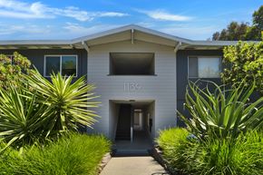 Belmont apartment for rent - A modern building with the number 1139 on it.