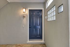 Belmont apartment for rent - A blue door with a number 01 on the wall above it.