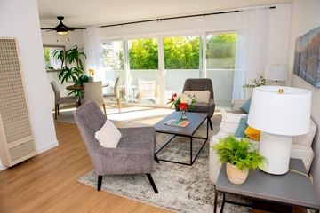 Redwood City apartment for rent - a living room with a couch and chairs and a table