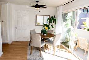 Redwood City apartment for rent - a dining room with a table and chairs and a ceiling fan