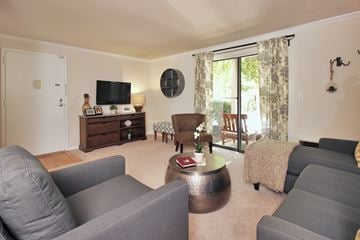Germantown apartment for rent - A living room with grey couches and a wooden coffee table.