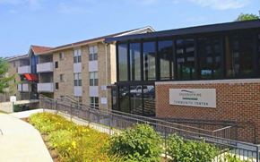 Baltimore City apartment for rent - A building with a sign that says Greenspring Community Center.