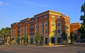 Arlington apartment for rent - A large red brick building with a yellow trim.