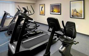 Arlington apartment for rent - A gym with a treadmill, elliptical trainer and a stationary bike.