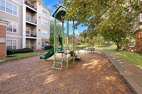 Germantown apartment for rent - A playground with a green slide and a yellow swing set.