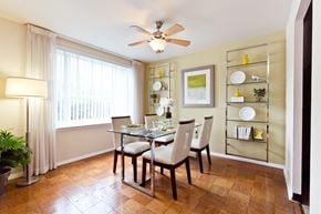 Arlington apartment for rent - A dining room with a table set for two and a ceiling fan.
