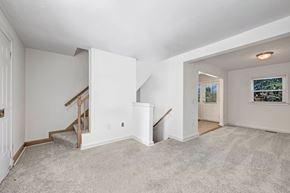 Arlington townhouse for rent - A spacious room with a staircase leading to the upper level.